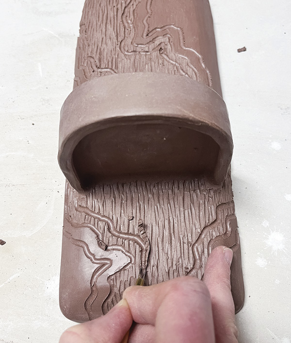 14 Allow the carving to flow from the top to the bottom of the form.