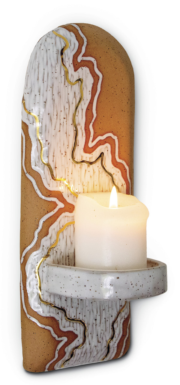 Handbuilt candle sconce, manganese speckled stoneware clay, carved, thick glossy-white glaze, fired to cone 5, gold luster, fired to cone 019, 2023.
