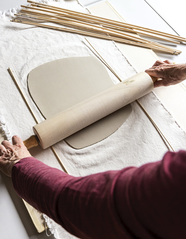 1 Roll out a clay slab using a set of ⅛-inch wood dowels.