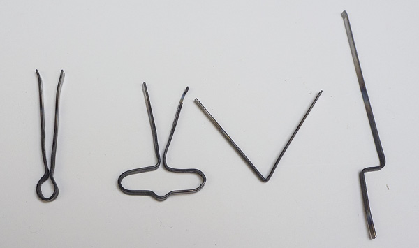 4 Formed wires from left to right: a loop tool, a handle extruder/cutter, a double-beveled cutter, and a stepped gallery cutter.