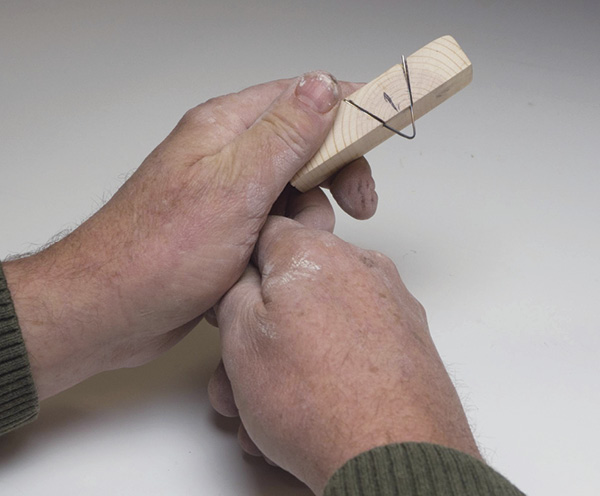 6 Insert the double-bevel wire cutter, ensure proper fit, then epoxy it in place.