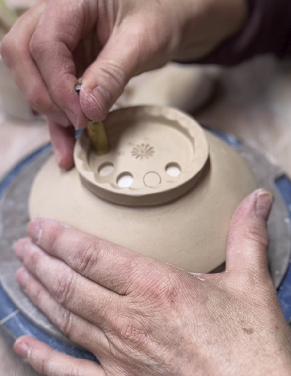 10 Add perforations to the interior of the foot ring.