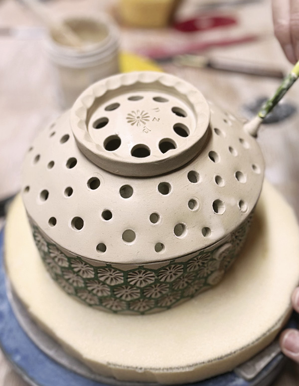 13 Perforate the bowl, then clean the holes with a paint brush.