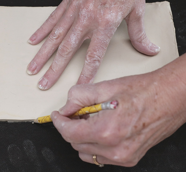 Example of using hands as a tool in forming clay.