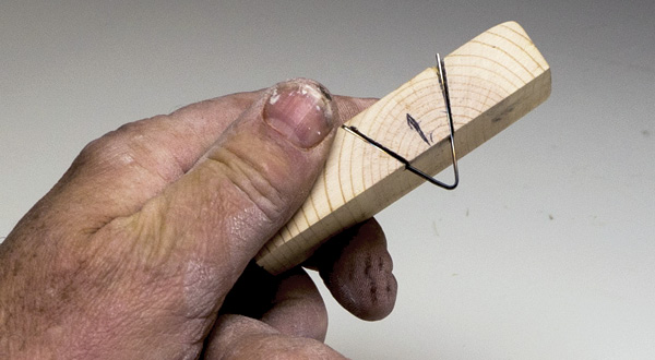 1 Double-bevel cutting tool made from a wood block and a windshield wiper blade.