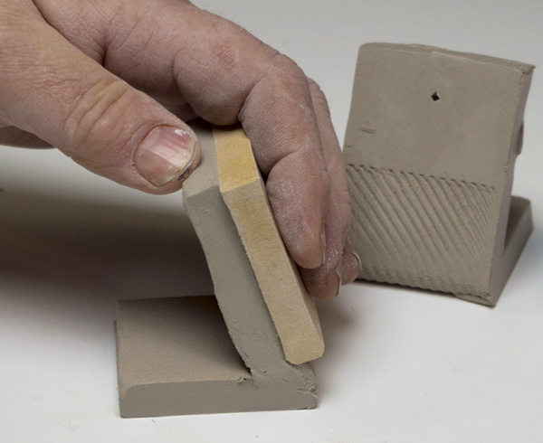 9 Use a wooden block to apply gentle downward pressure to create a glaze stop.