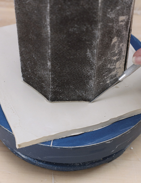 10 Set the tumbler onto a slab. Trace around it, creating a foot, then attach.