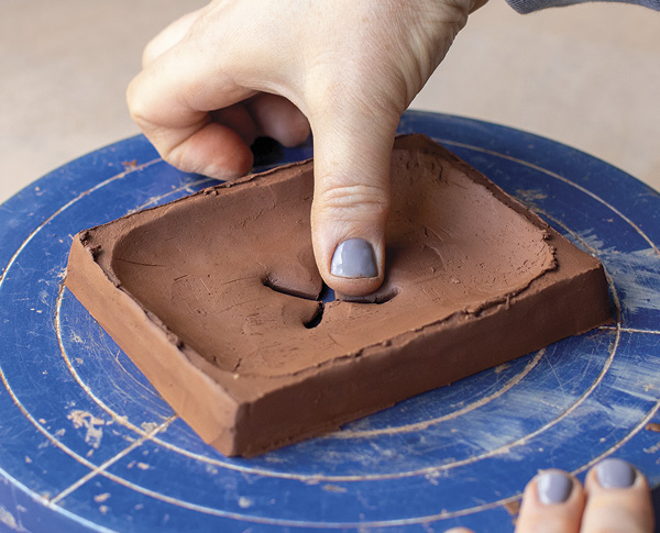 4 Use your fingers to soften and refine the X shape, which will serve as drainage.