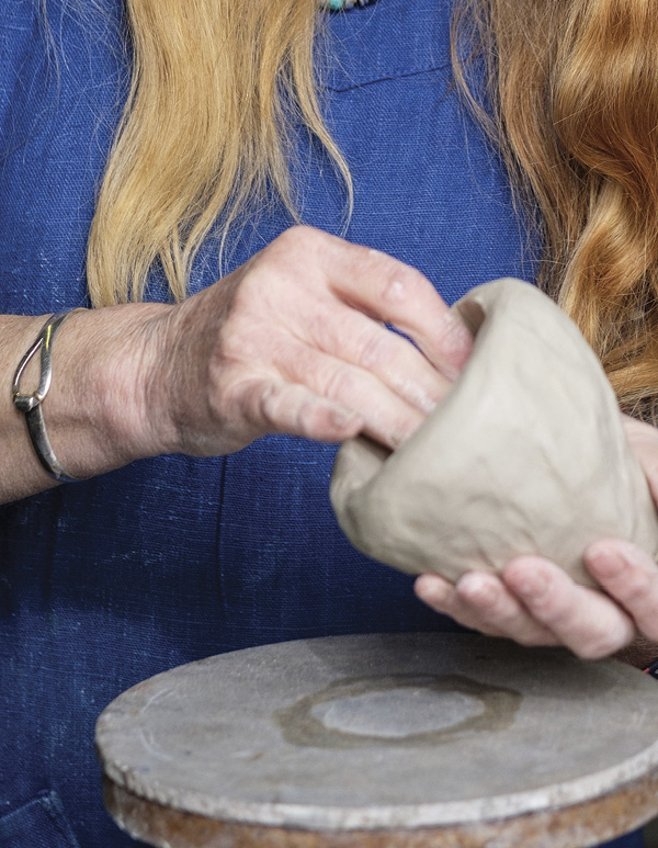 1 Begin with a ball of clay and pinch out the initial form.