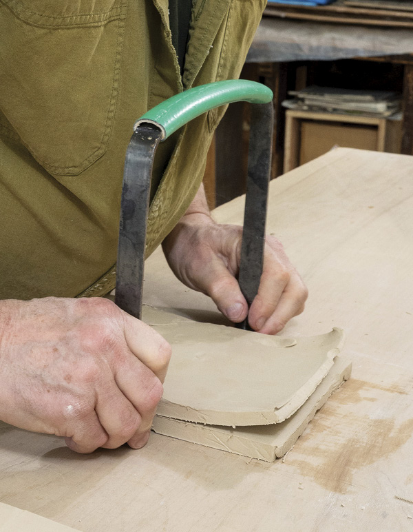 3 Firmly holding the tool vertical, pull toward you from the far end of the block.
