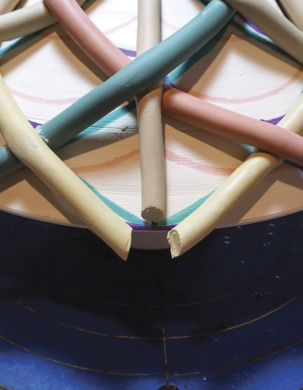 10 At the bottom, cut the coils to the correct length for their final connection.