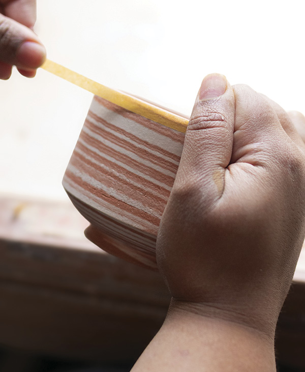 7 Tape the rim of the pot. The tape acts a form of wax resist.