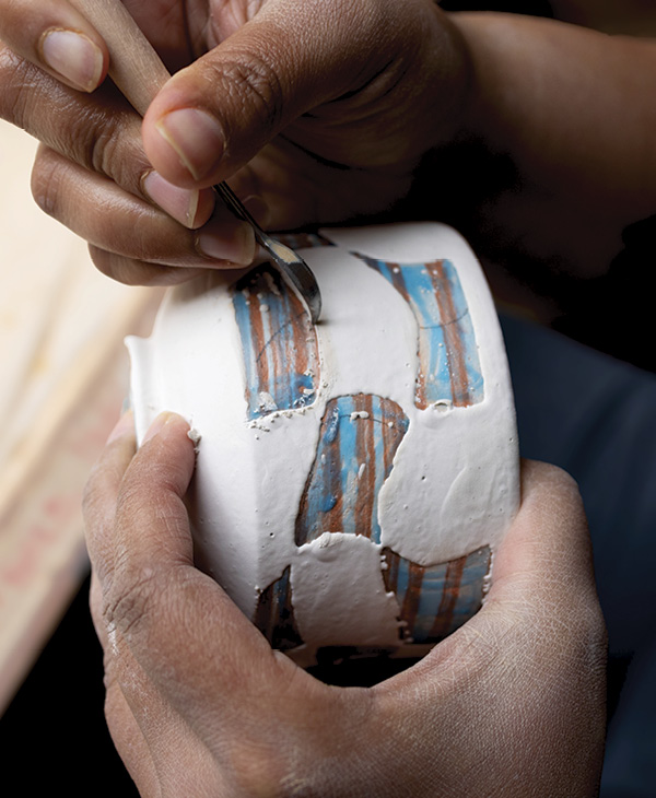 12 Use a pointed tool to scrape off any excess glaze.