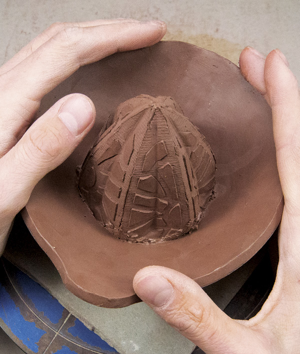 10 Slip and score around the base of the spike and on the bowl’s bottom rim, and then thread the spike into the bowl.