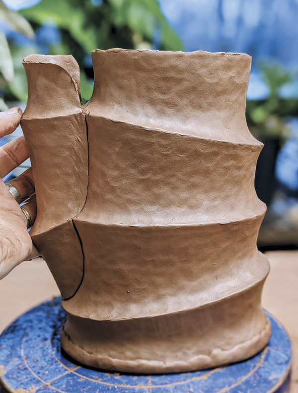 1 Kate Marotz adding a pinched spout to her accordion-style pitcher.