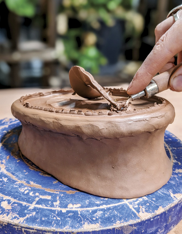 4 Trim the bottom. Blend in any clay burrs for a smooth surface.