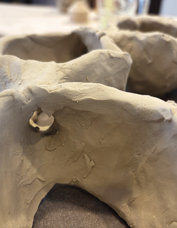 7 Create a hollow channel between each lobe for water to flow once it’s fired.