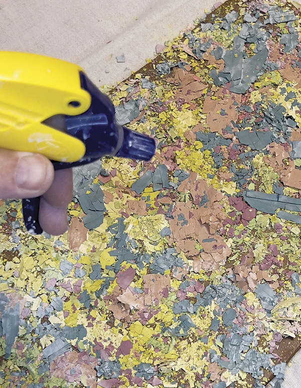 4 Once you’re happy with the palette, lightly spritz the dried slips with water.