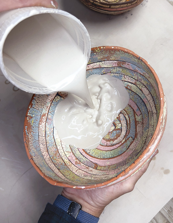 16 Pour glaze inside the bowl, swirl, and pour out. Wipe the rim. Fire to cone 5.