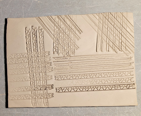 3 A clay slab sample of texture created with the two different cardboard edges.