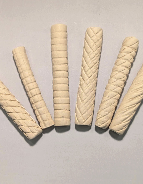 15 Various bisque-fired rollers, which can be used to texture slabs and vessels.