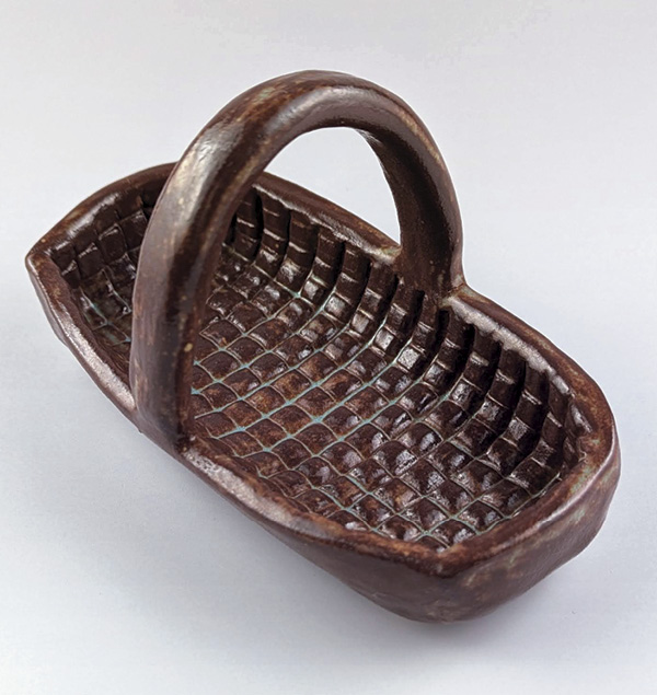 Jennifer España's Basket, textured with a bisque roller, commercial glazes, fired in oxidation to cone 6.