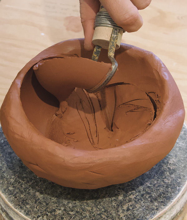 7 Once you have carved a fluid pass, remove the ribbon of excess clay.