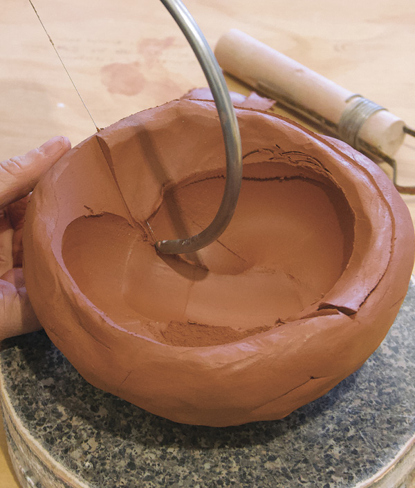 9 Use a knife or wire harp to define the basin’s lip.