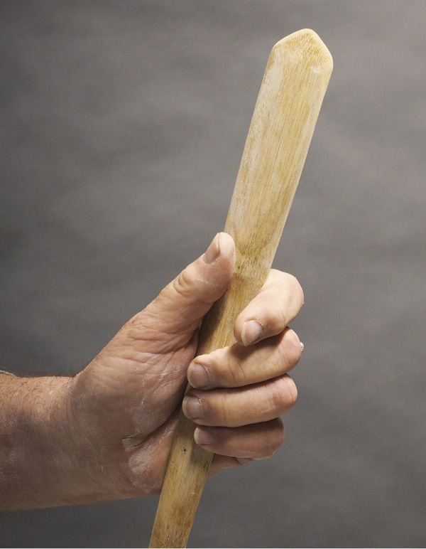 2 A bamboo spoon altered and shaped into a 45-degree point.