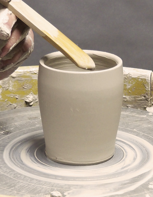 3 Insert the point to the base of the cylinder and draw it up to create a corner.