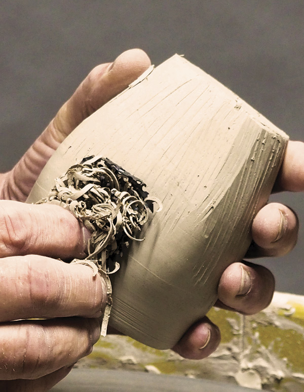 7 Use a Surform blade to taper and shape the leather-hard form.