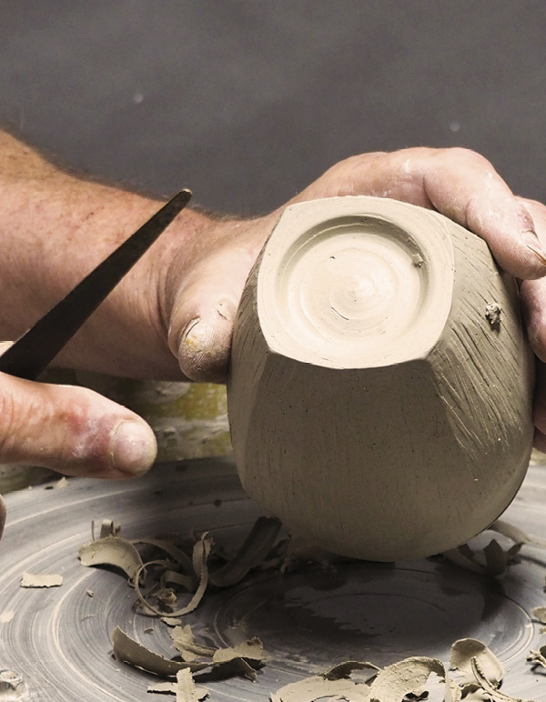 9 Secure the cup to the wheel head and trim in a foot.