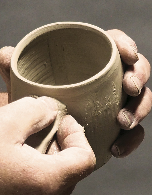 10 Score, slip, and attach one of the handle blanks to the form.