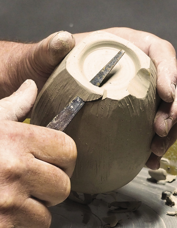 13 Alternatively, use a fettling knife to cut four feet into the foot of the cup.