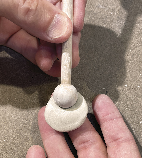 B3 Use your thumb or a small ball tool to indent one side of the thumb rest disc.