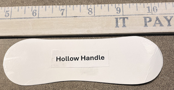 C1 Begin by cutting out a pattern that looks like a wide tongue depressor or a dog bone. Then trace it onto a clay slab.