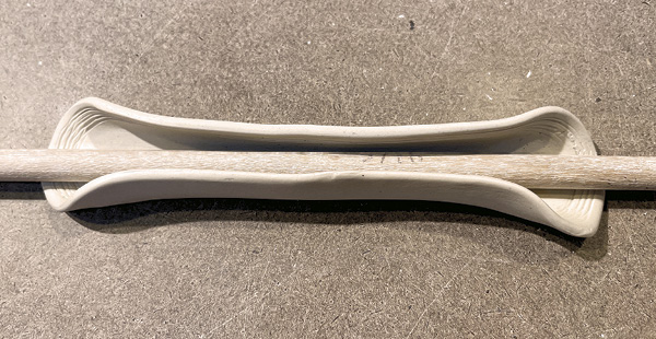 C3 Gently bend the sides of the shank of the bone shape until they almost meet.