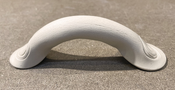 C5 Turn the piece over and stroke it to bend it into a standing arch with the bone ends lying flat on the table