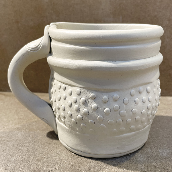 C6 Add slip to the already scored areas of the bone ends and to the scored part of the vessel, and join the pieces.