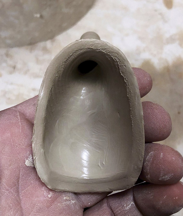 16 Stretch the interior of the spout and pinch the edge to create a beveled edge for a clean mount to the teapot body.