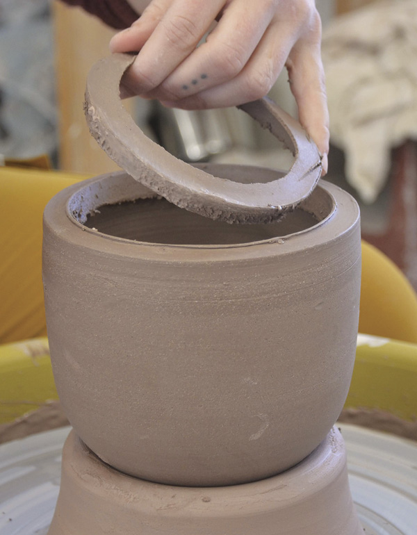 9 Remove the excess clay, then trim and refine the rim.