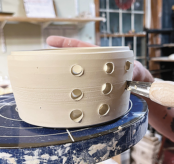 11 Pierce holes on the bottom section of the pot.