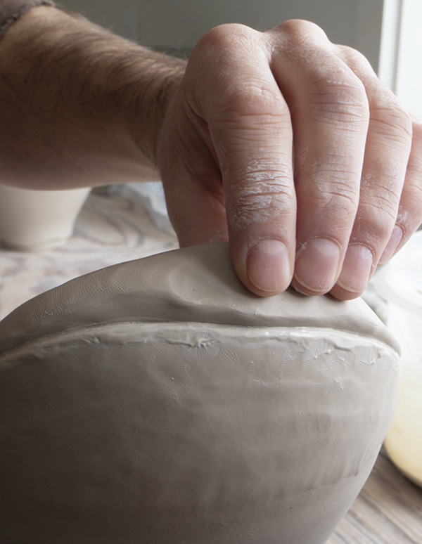 9 Add a second tapered coil and begin to pinch it up.