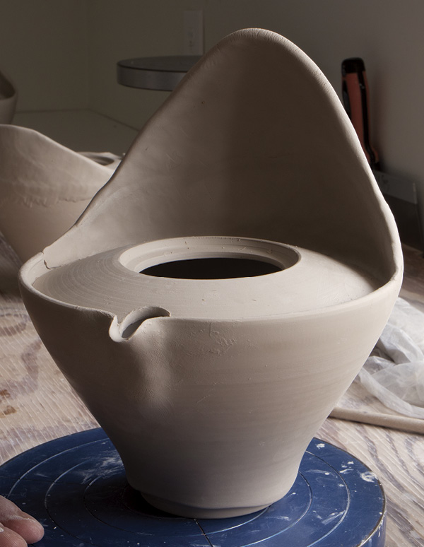 10 Continue to pinch up the second tapered coil into a tall wall.