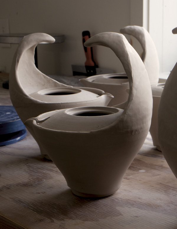 13 Add a third and final tapered coil and pinch it up into a handle.