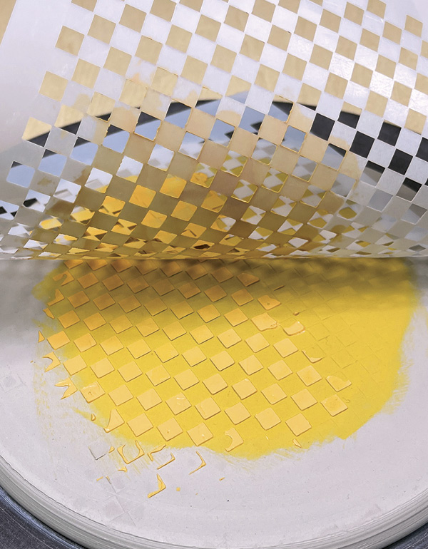 5 Remove the stencil by gently lifting and peeling it back.