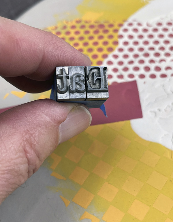 15 Select the text using individual letterpress type. Press the type into the clay.