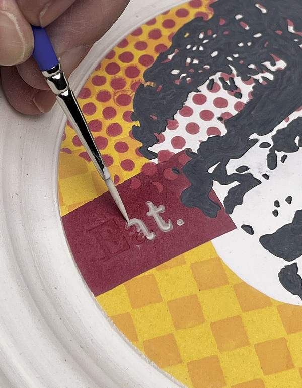 28 Apply a contrasting underglaze color to the lettering impressions.