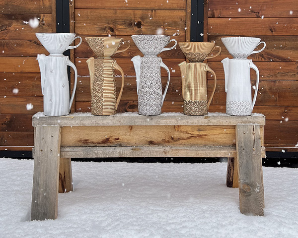 A selection of Matt Hiller's finished coffee pour-overs with a variety of surface decorations.