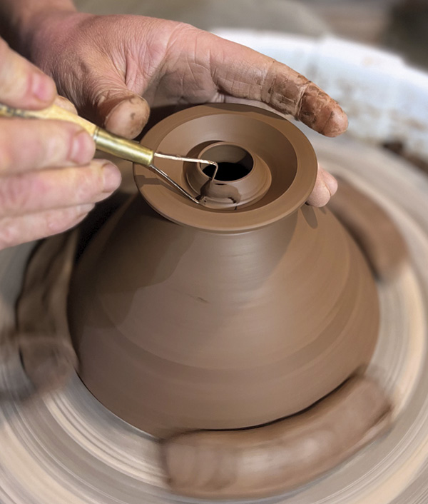 10 Trim a hole and a foot ring, then continue to form the funnel shape of the pour-over cone.
